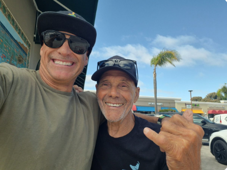 Matt with a longtime South Bay client, both smiling outside on a sunny day